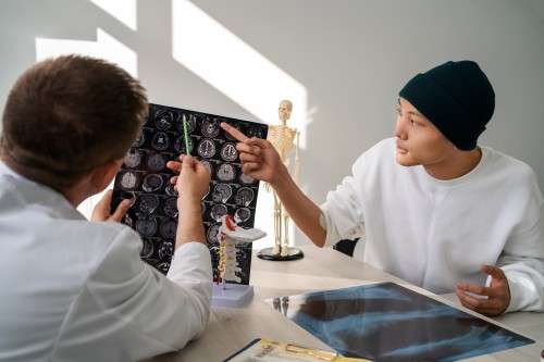 patient and doctor going over medical images
